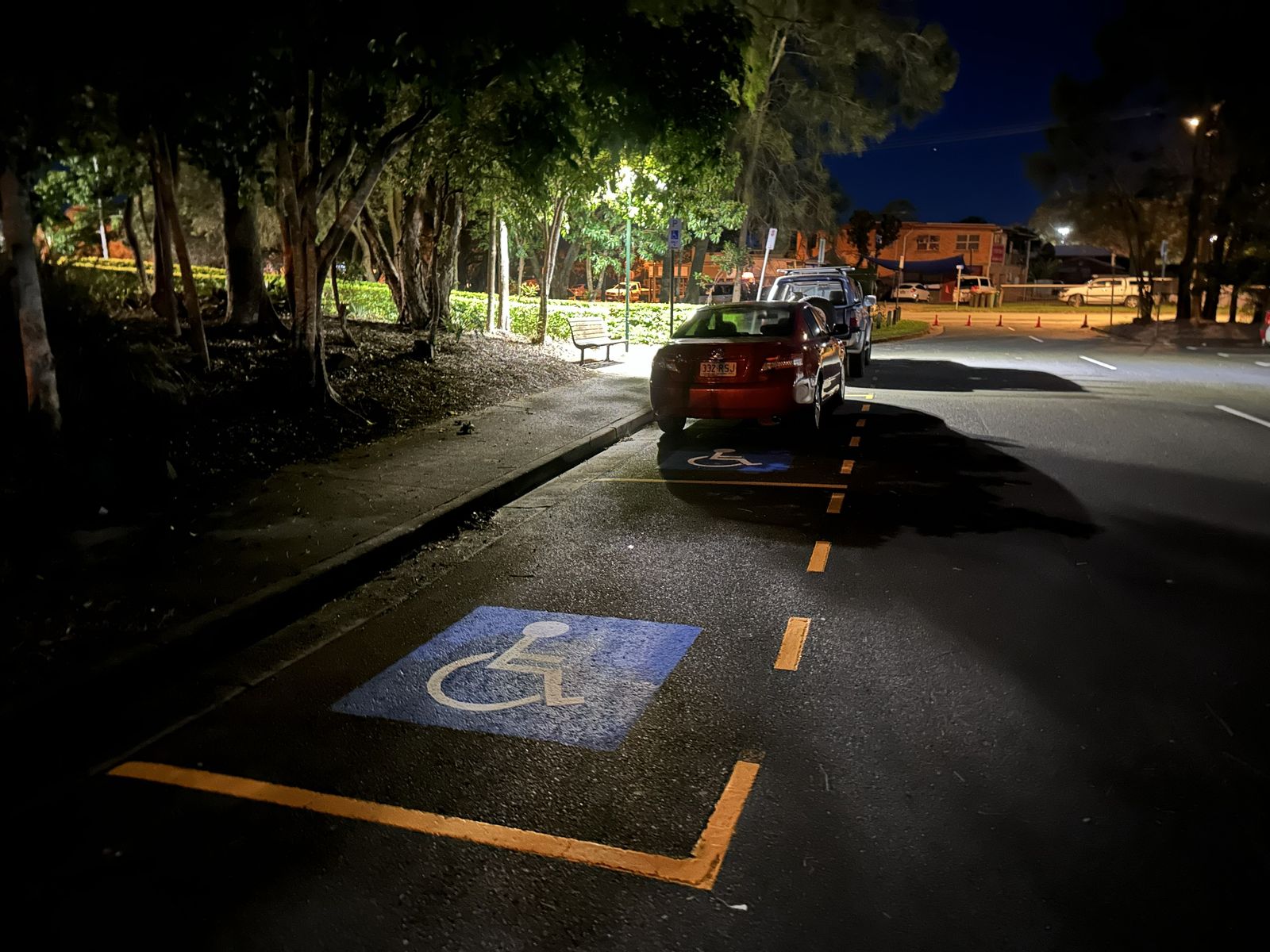 Accessible parking bay pavement symbol and line marking