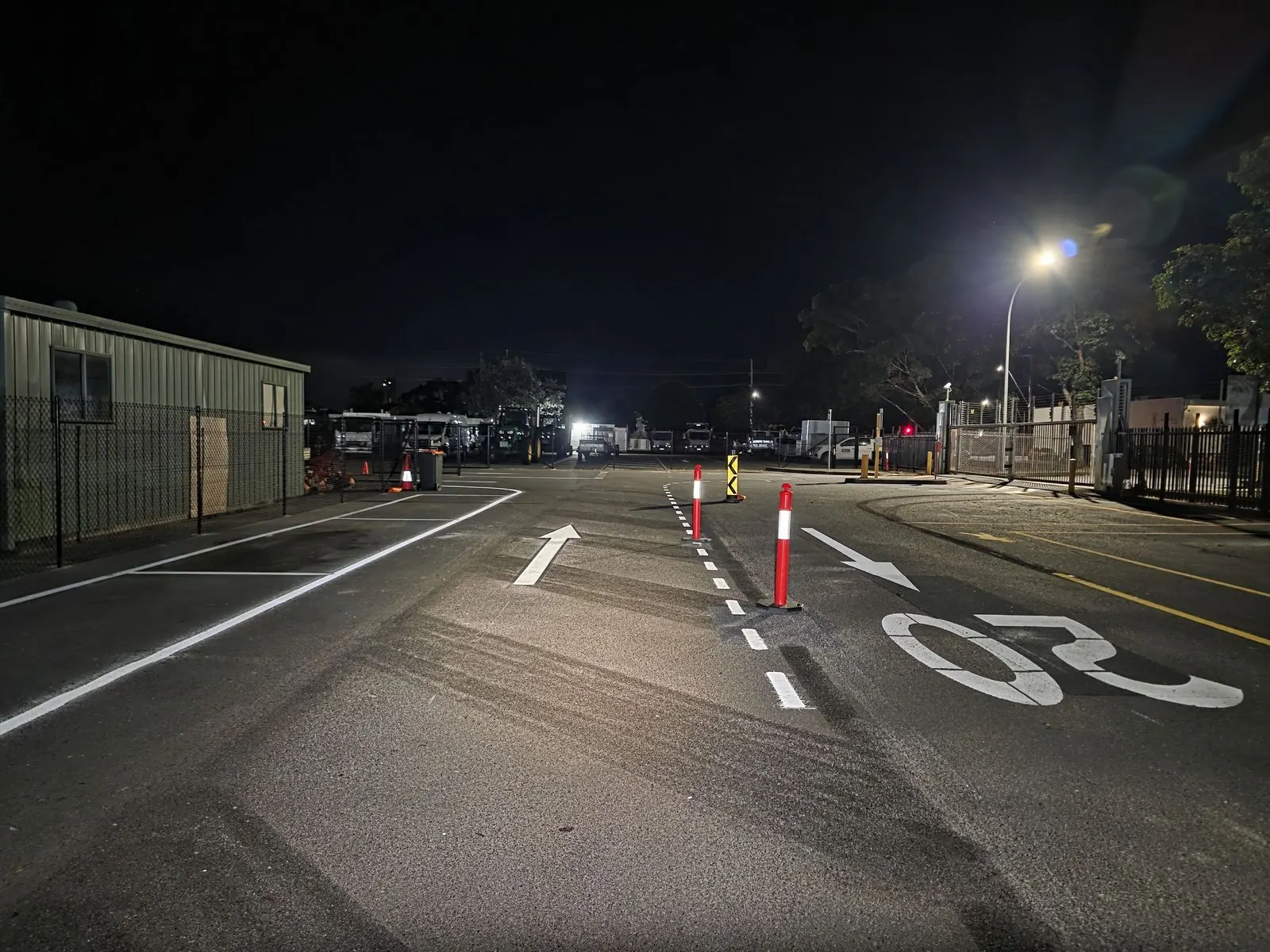 Roadway traffic arrows and white directional line marking